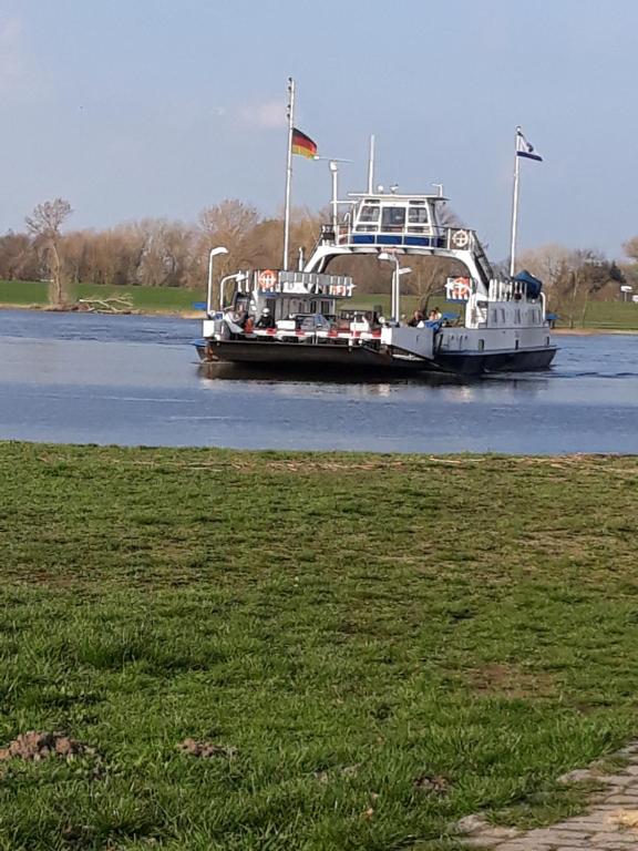 a boat in the water on a river at Ferienwohnung an der Elbe in Bleckede