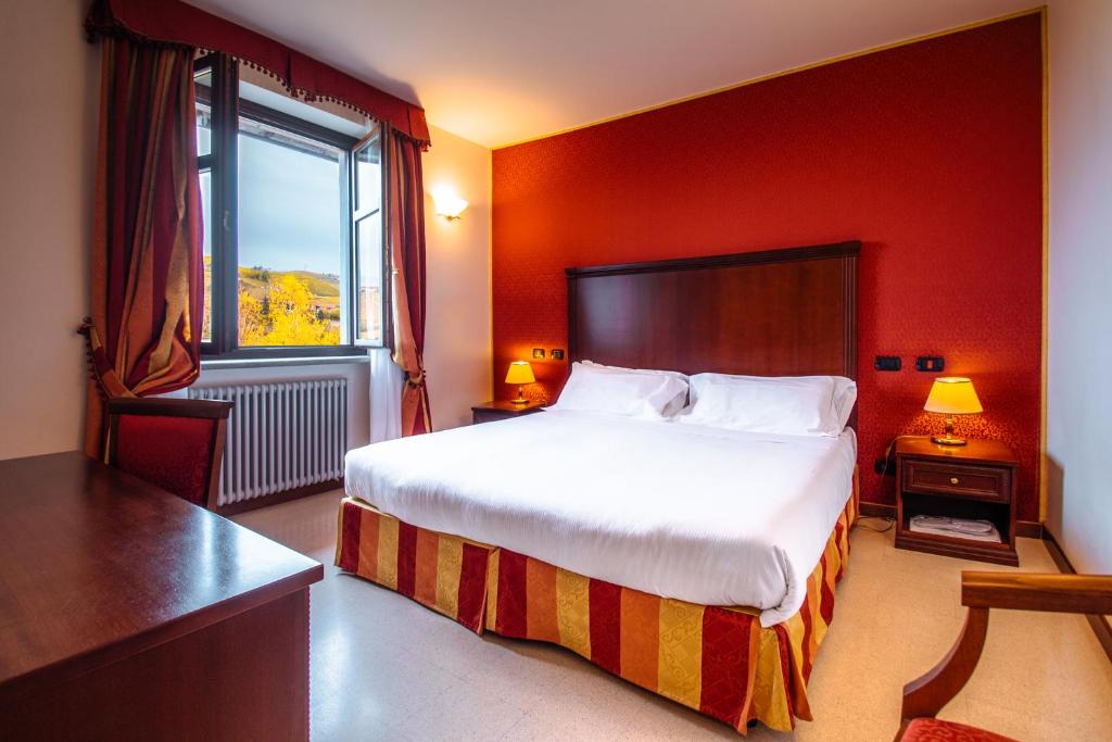 Postel nebo postele na pokoji v ubytování Hotel Villa Lauri