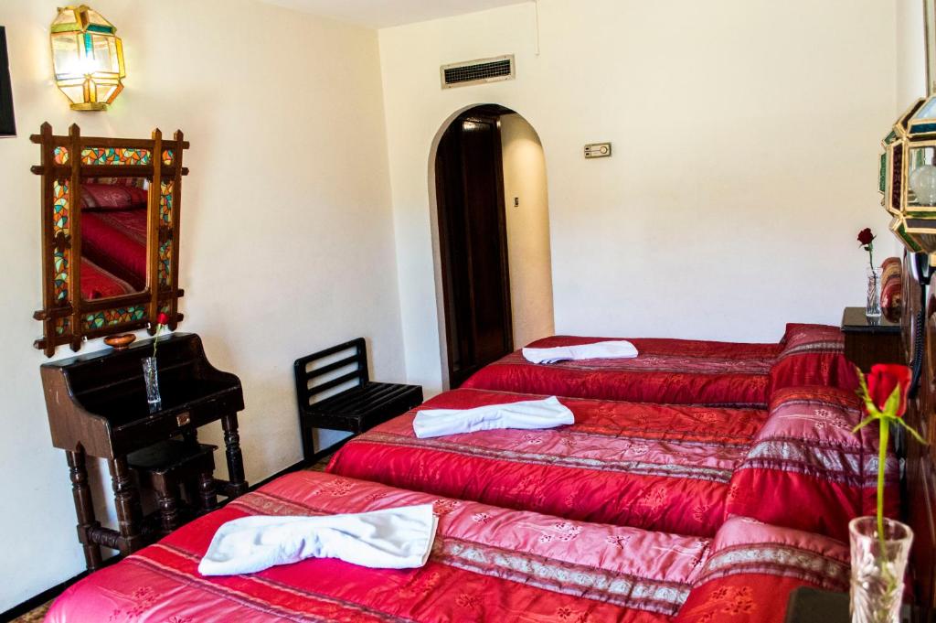 Postel nebo postele na pokoji v ubytování Hotel Tachfine