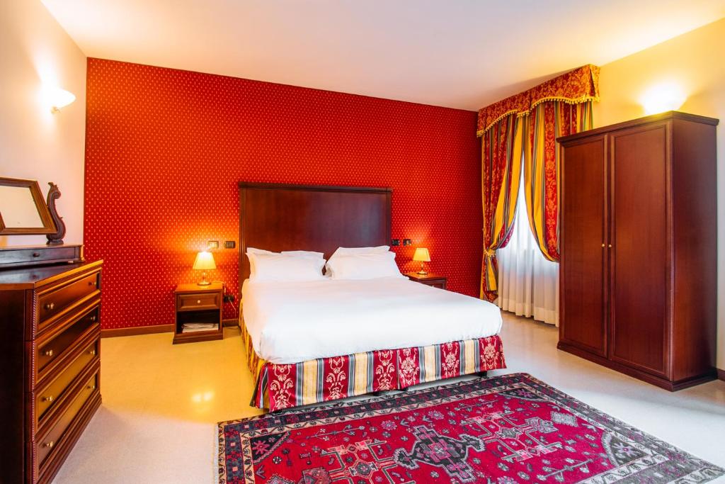Postel nebo postele na pokoji v ubytování Hotel Villa Lauri