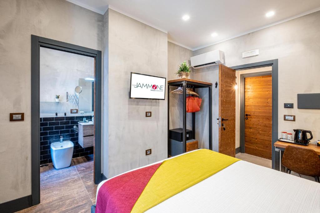 Postel nebo postele na pokoji v ubytování casajammone naples b&b