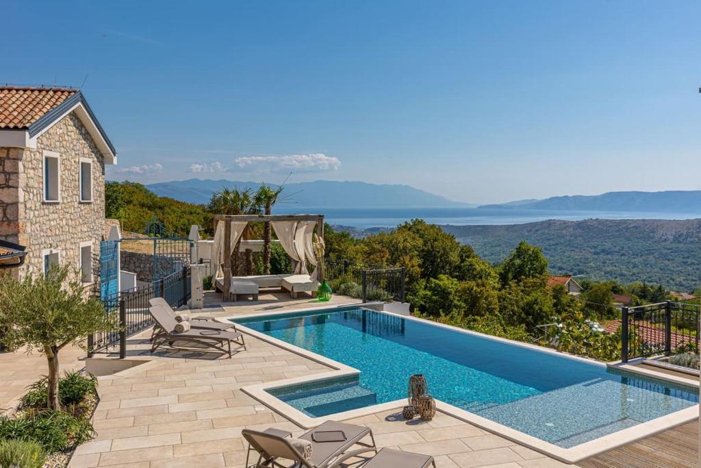 a villa with a swimming pool with a view at Villa 72 Crikvenica Riviera in Bribir