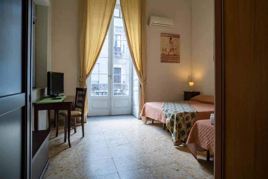 A bed or beds in a room at San Demetrio