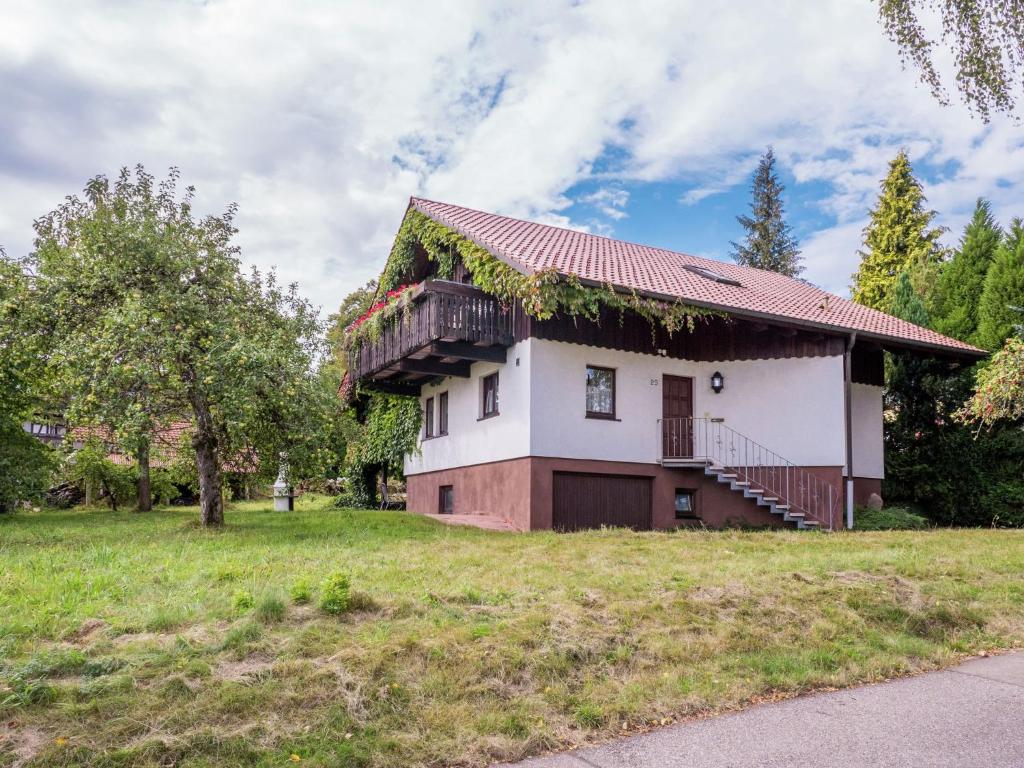 a house with ivy growing on the roof at Holiday home in Lossburg near the ski area in Loßburg