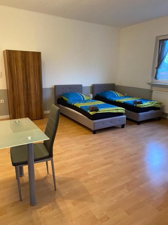 a living room filled with furniture and a flat screen tv at Family Apartments Lübeck in Lübeck