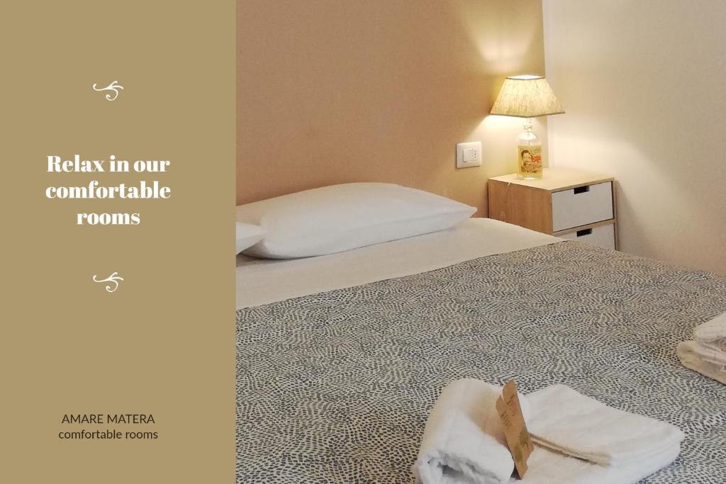 Posteľ alebo postele v izbe v ubytovaní AMARE MATERA comfortable rooms