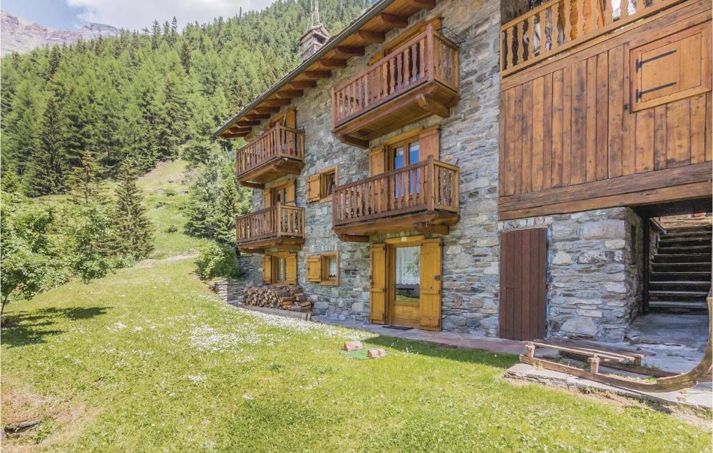 a building with wooden balconies on the side of it at Valsavarenche in Maisonasse