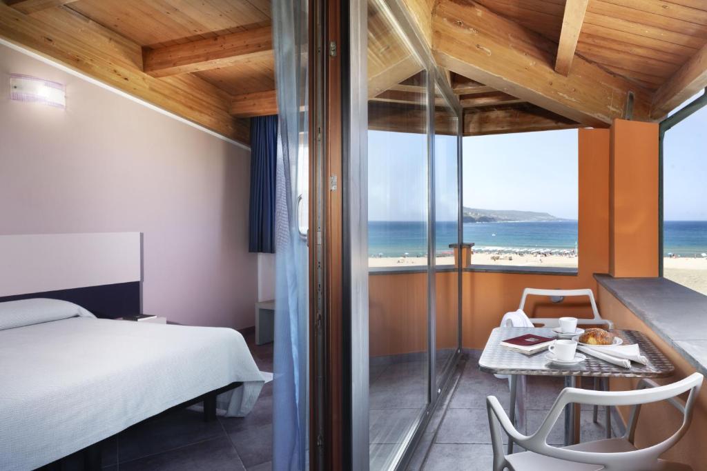 Postel nebo postele na pokoji v ubytování Hotel Al Gabbiano