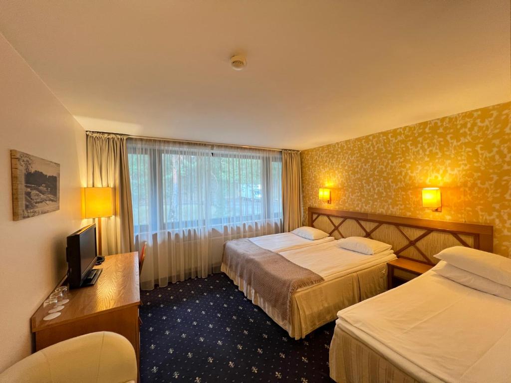 Postel nebo postele na pokoji v ubytování Park Villa Hotel