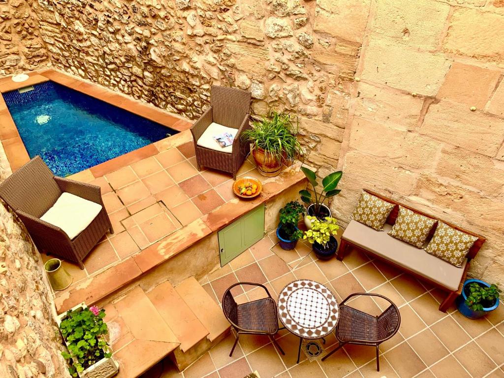 an overhead view of a patio with chairs and a pool at Casa Romana in Pollença
