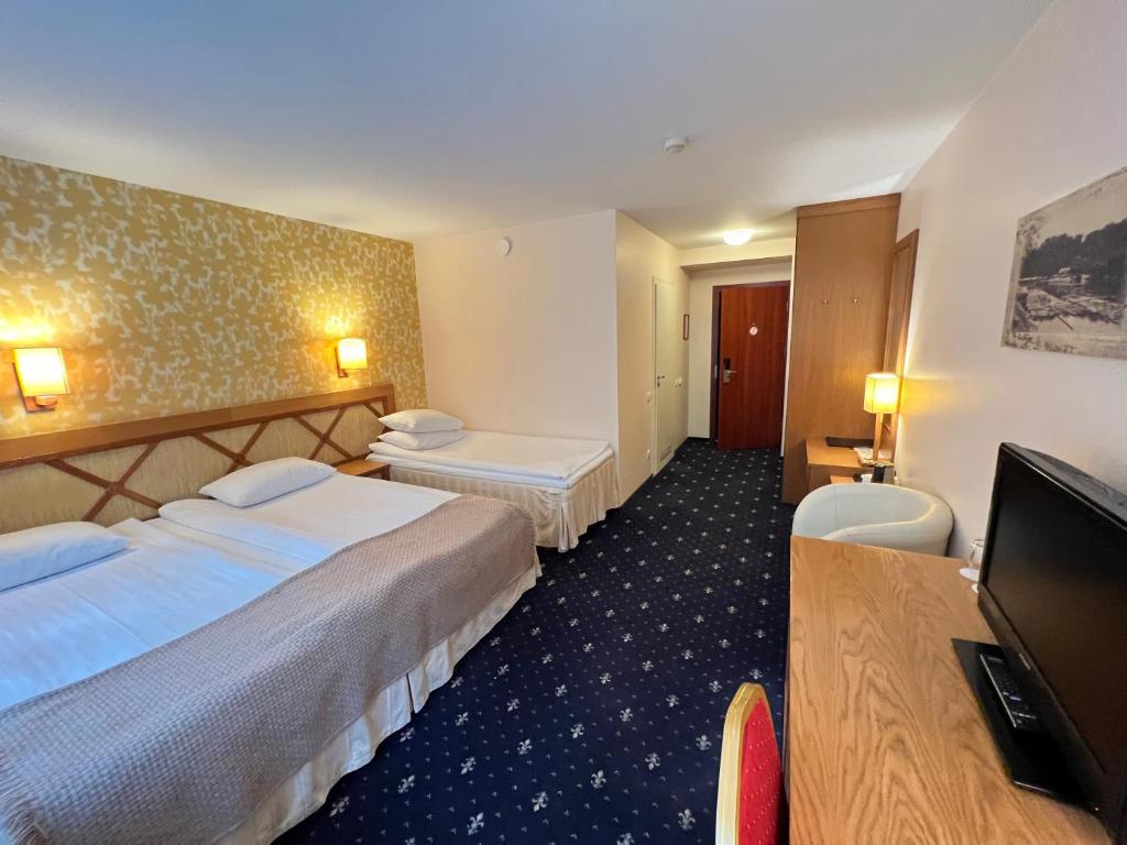 Postel nebo postele na pokoji v ubytování Park Villa Hotel