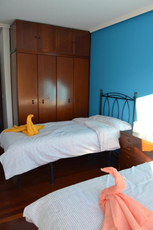 Postel nebo postele na pokoji v ubytování La Casa de Fito cerca del centro de Comillas