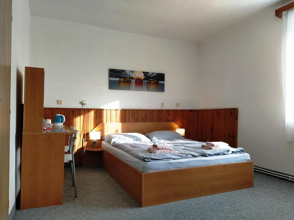 Postel nebo postele na pokoji v ubytování Prázdninový dům Na Panorámě
