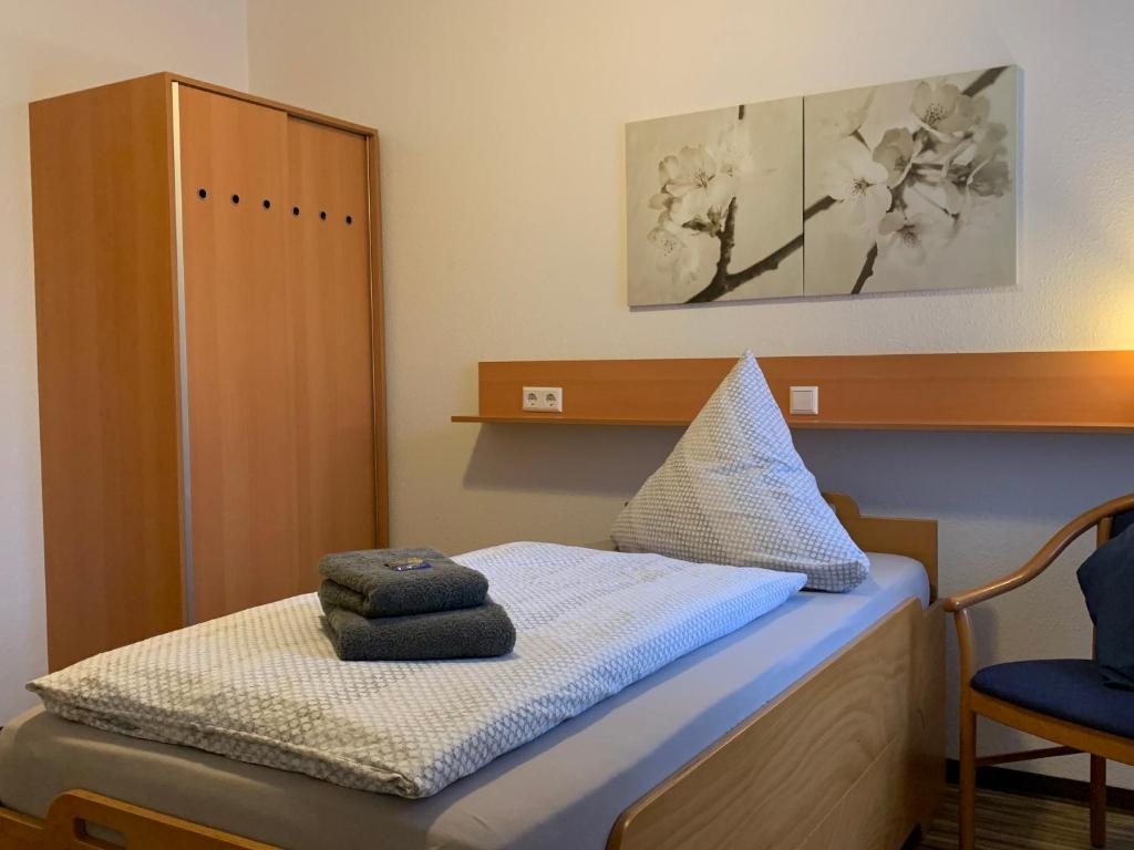 Postel nebo postele na pokoji v ubytování Landgasthaus-Hotel Wenninghoff