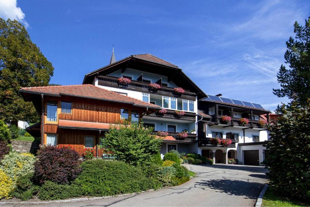 a house with solar panels on the side of it at Apartments Wandaler in St Georgen am Kreischberg in Sankt Georgen ob Murau