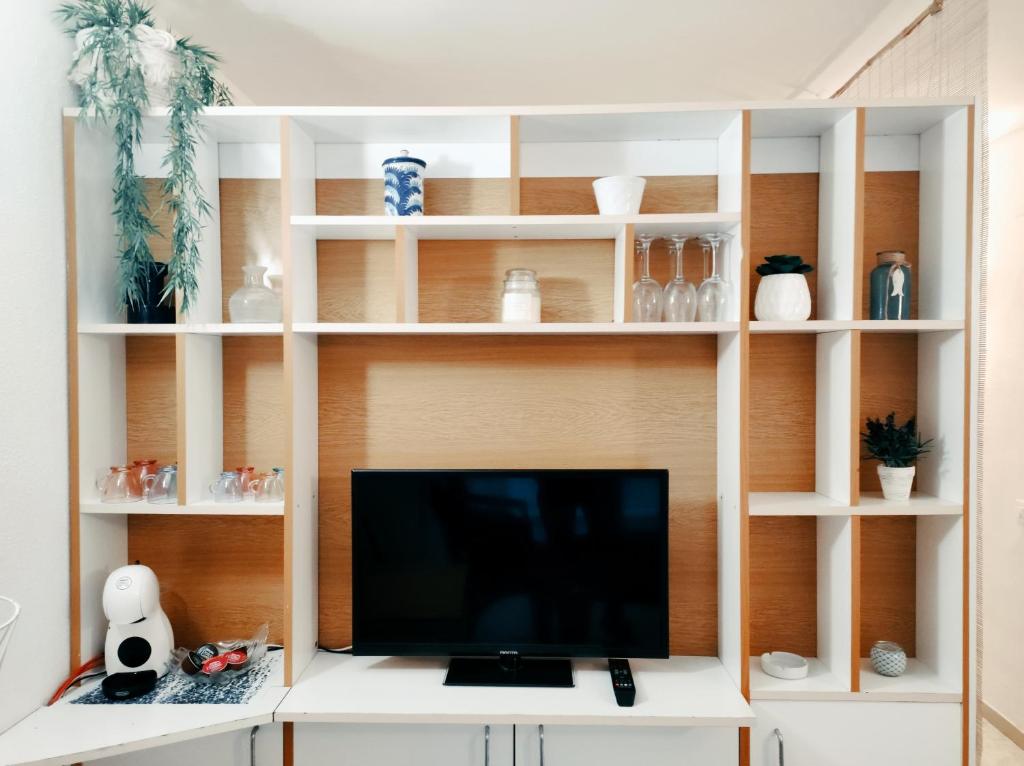 TV a/nebo společenská místnost v ubytování Apartamento junto al mar