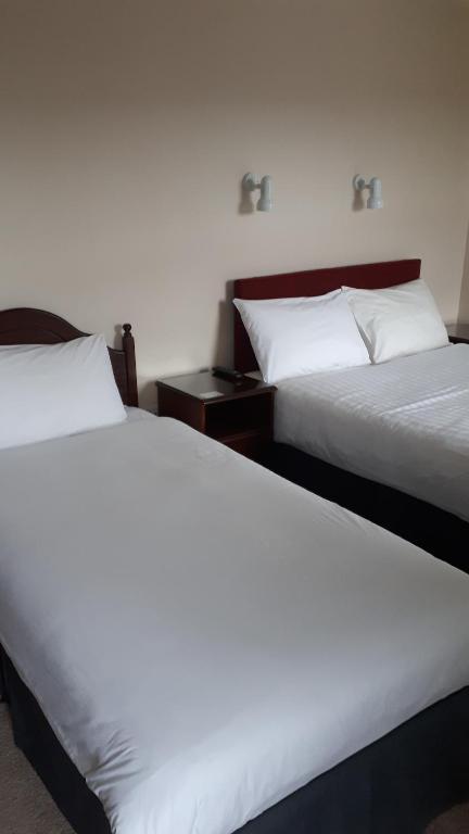 Postel nebo postele na pokoji v ubytování Bay View Guesthouse