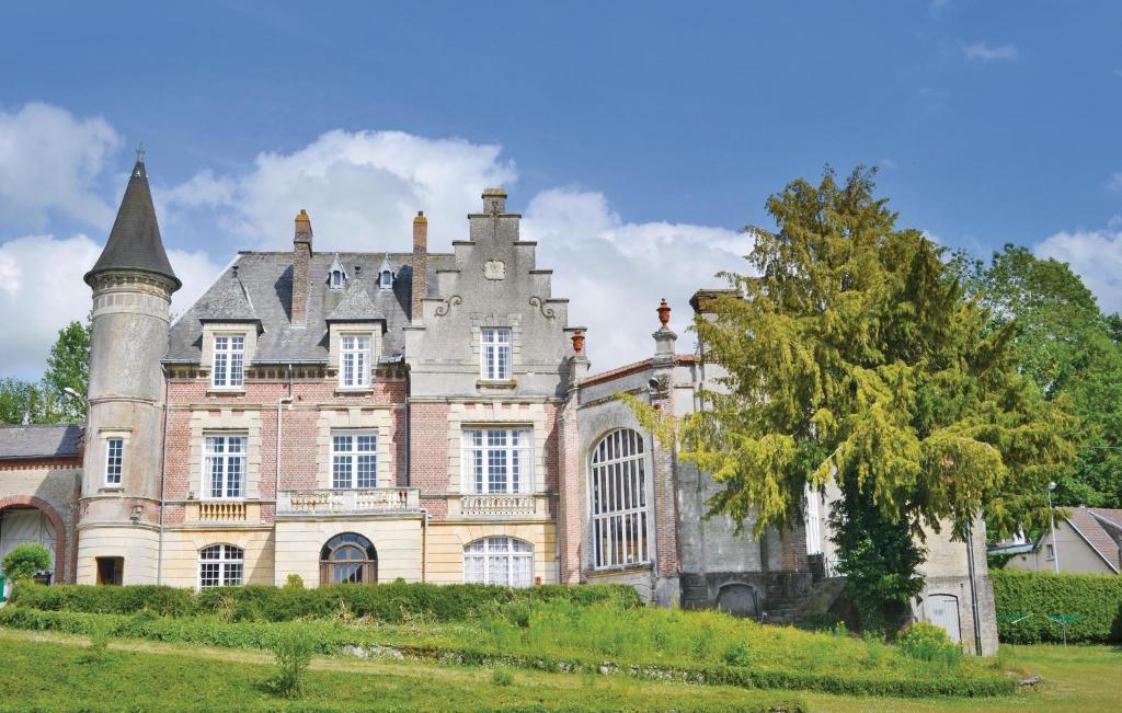 an old castle with a tree in front of it at Amazing Home In Marconne With Kitchen in Marconne
