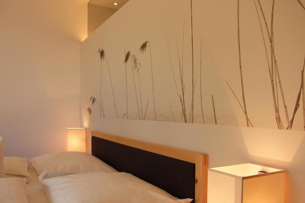 Postel nebo postele na pokoji v ubytování Steindl's Boutique Hotel