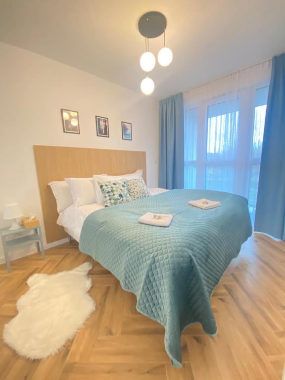 Postel nebo postele na pokoji v ubytování Apartamenty Bonjour Szyndzielnia