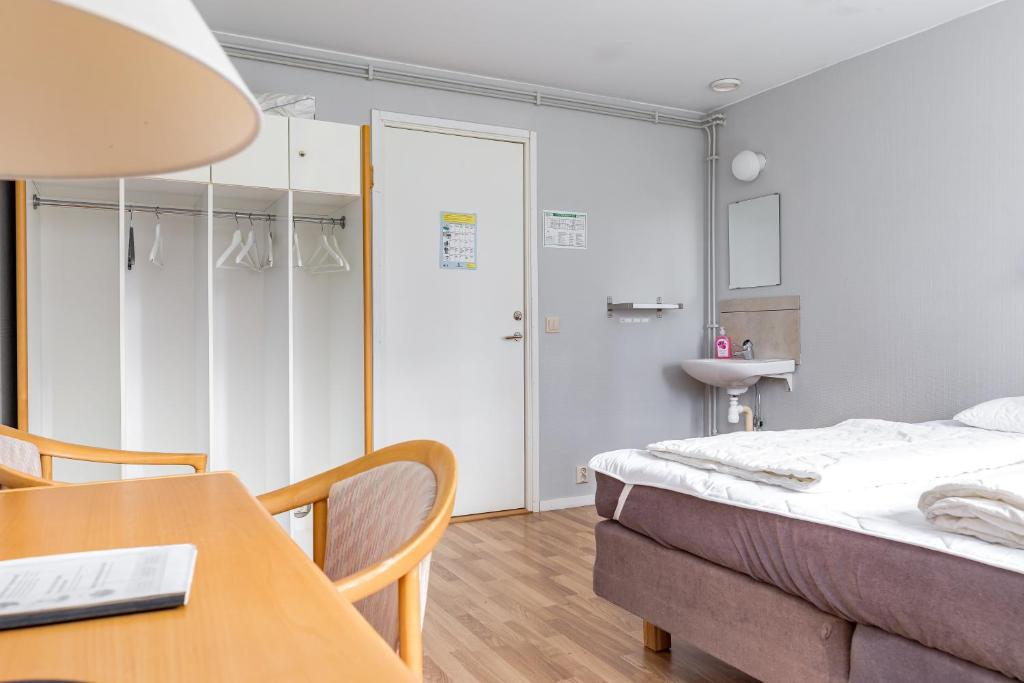 Postel nebo postele na pokoji v ubytování STF Baskemölla Hostel