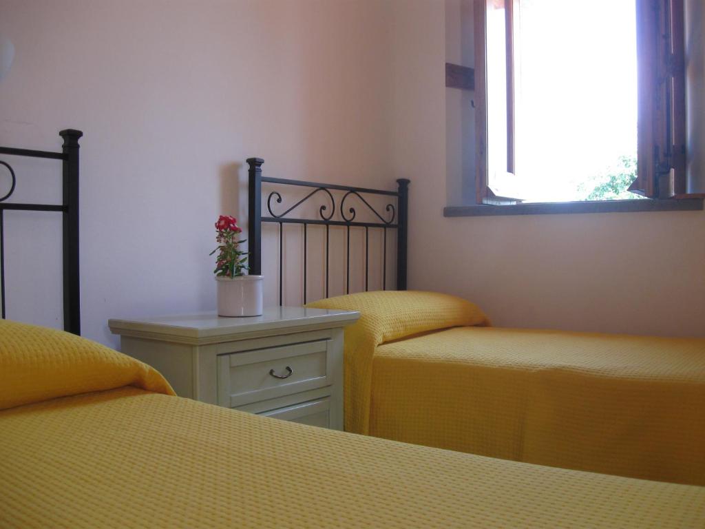Postel nebo postele na pokoji v ubytování Agriturismo Galea