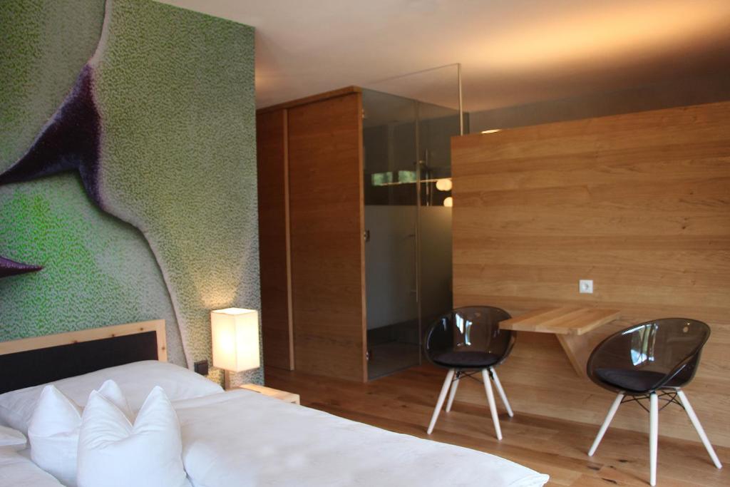 Postel nebo postele na pokoji v ubytování Steindl's Boutique Hotel