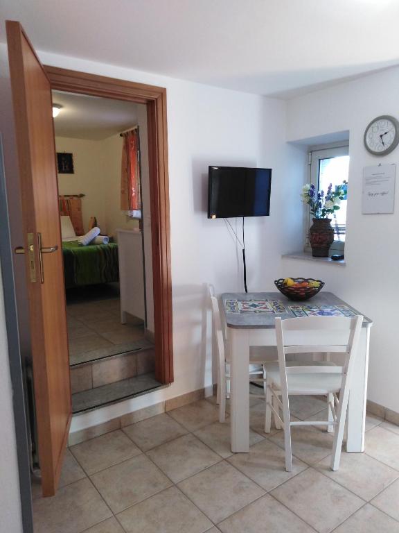 Televízia a/alebo spoločenská miestnosť v ubytovaní Porta Nuove Vacanze