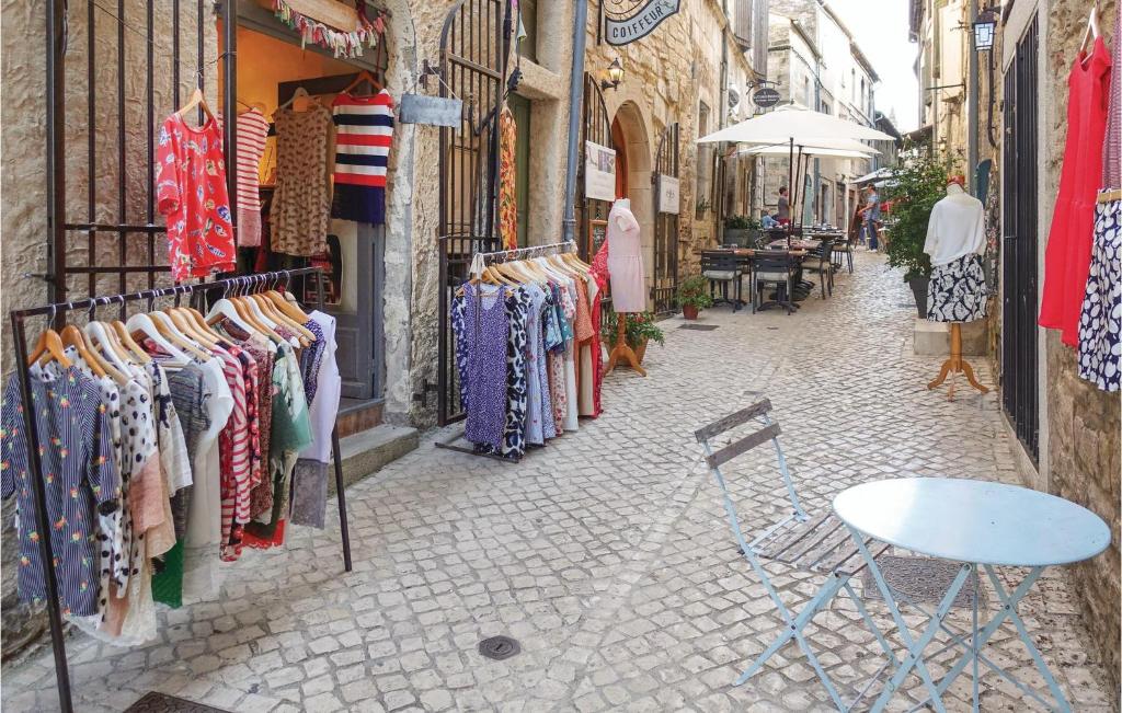 an alley with clothes on display in a store at Awesome Home In Bessges With Wifi in Bessèges