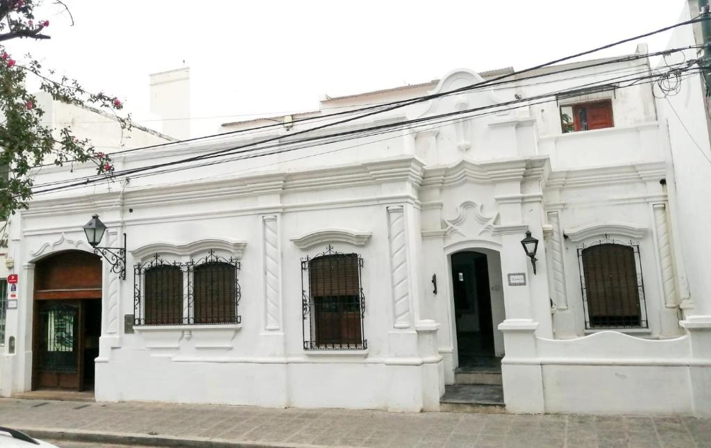 a white building on a city street at Terraza de la Usina in Salta