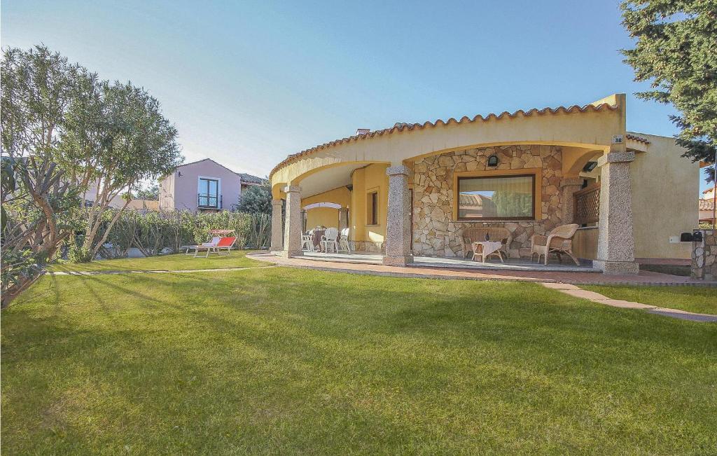 a house with a yard with a grass field at Lovely Home In Ca- With Wifi in Monte Nai