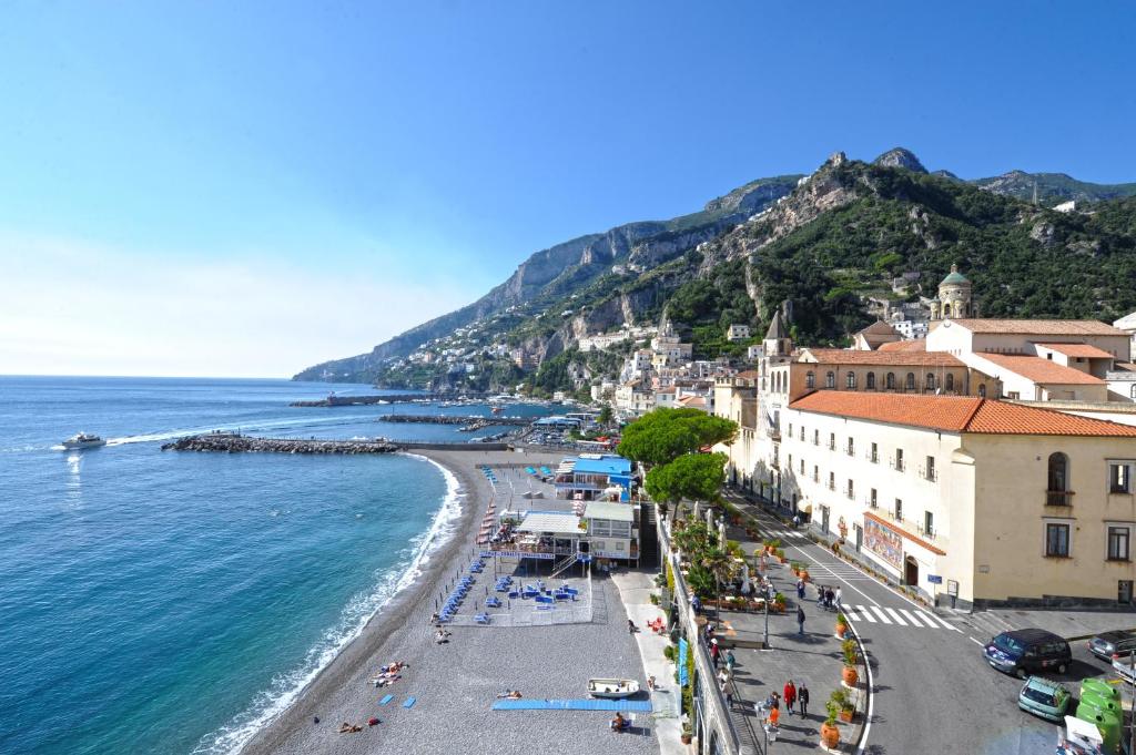 a view of the beach in positano on the amalfi coast at Dolce Vita A in Amalfi