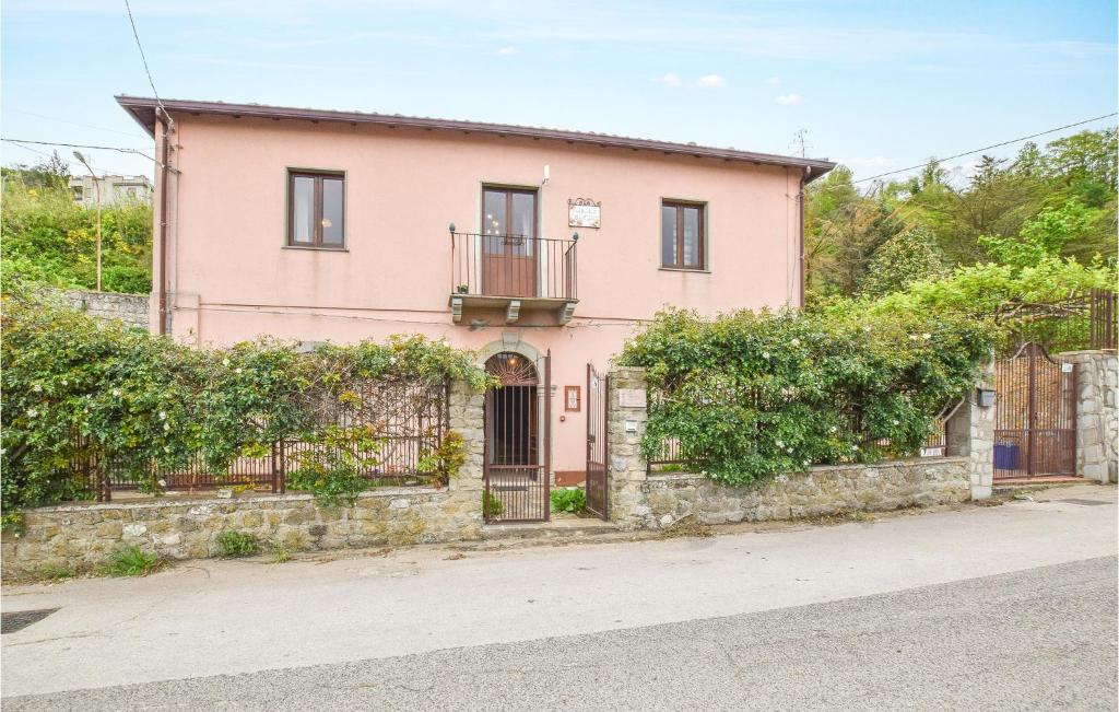 a pink house on the side of a street at Amazing Home In Raccuja With 4 Bedrooms And Wifi in Raccuia