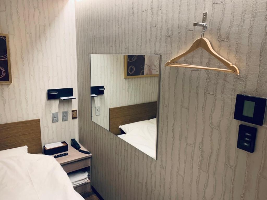 Postel nebo postele na pokoji v ubytování Hotel Charire Kichijoji