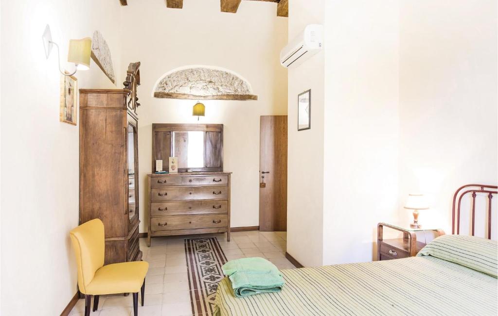 A bed or beds in a room at Casale Malena