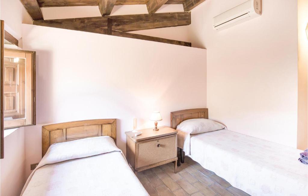A bed or beds in a room at Casale Malena