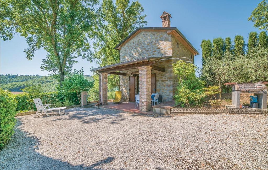 a stone house with a gazebo in a yard at Stunning Home In Monterchi Ar With 1 Bedrooms in Monterchi