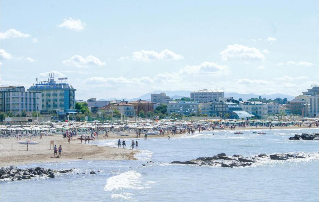 a group of people on a beach near the water at Casa Luisa in Gabicce Mare