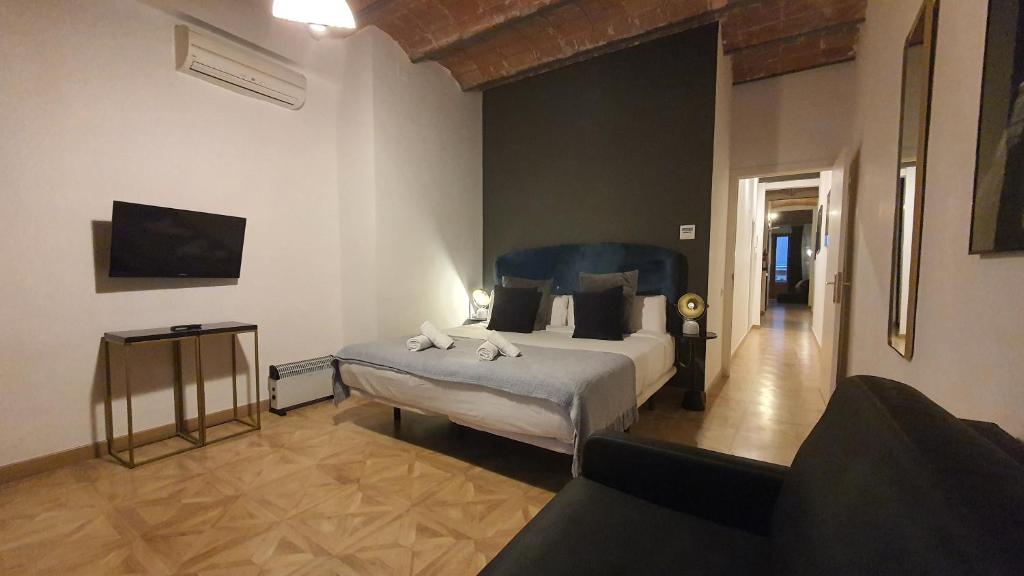 Postel nebo postele na pokoji v ubytování Barrio Gotico Apartments Escudellers