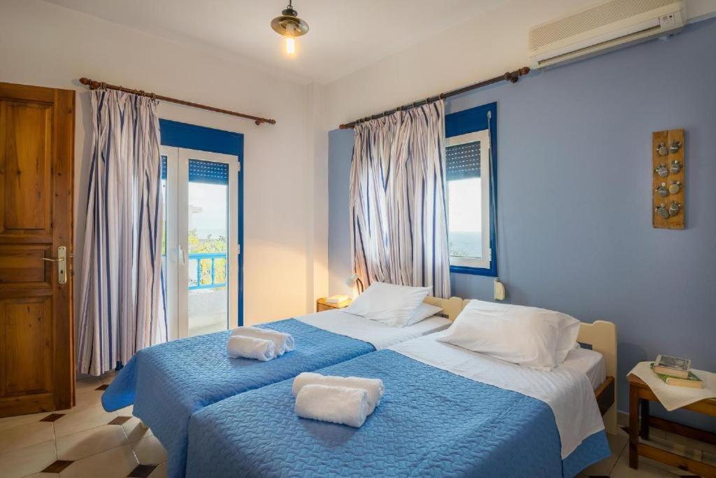 A bed or beds in a room at Creta Sky
