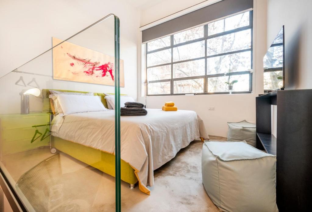 Posteľ alebo postele v izbe v ubytovaní Loft 19