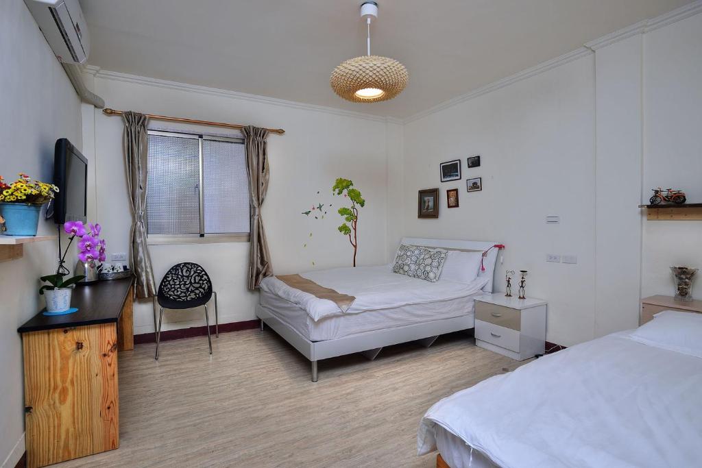 Postel nebo postele na pokoji v ubytování Ding Ding Homestay