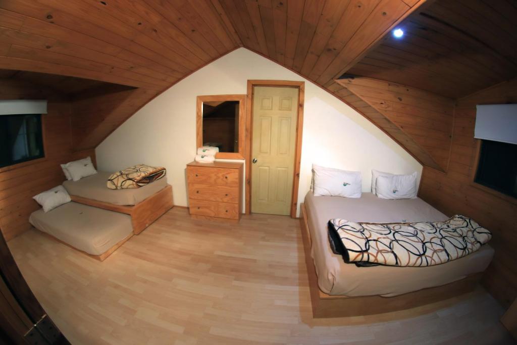 Postel nebo postele na pokoji v ubytování Cabañas Molino del Rey