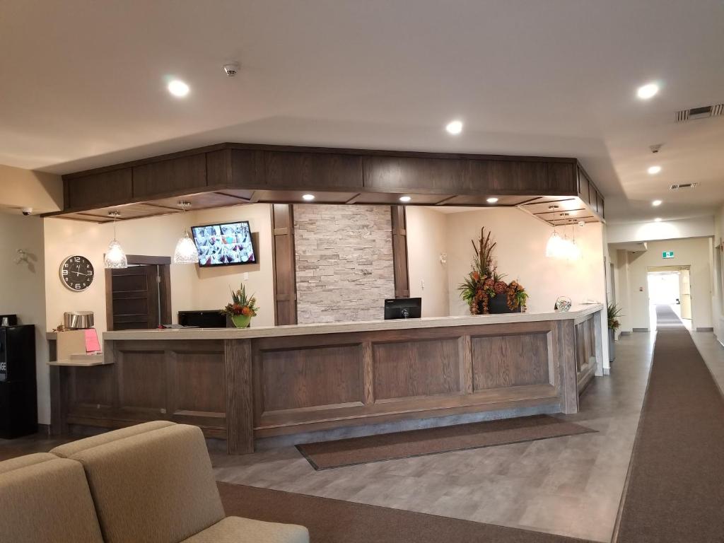 
a large room with a large counter and a large window at Western Budget Inns & Suites Leduc in Leduc
