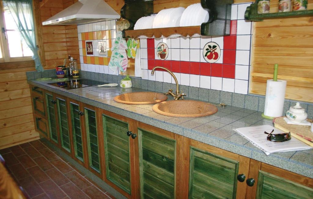 Kuchyň nebo kuchyňský kout v ubytování Wooden Dreamhouse Arriate