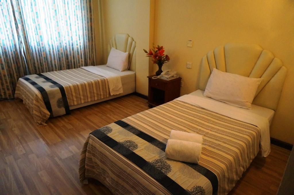 Postel nebo postele na pokoji v ubytování Jeruton Hotel