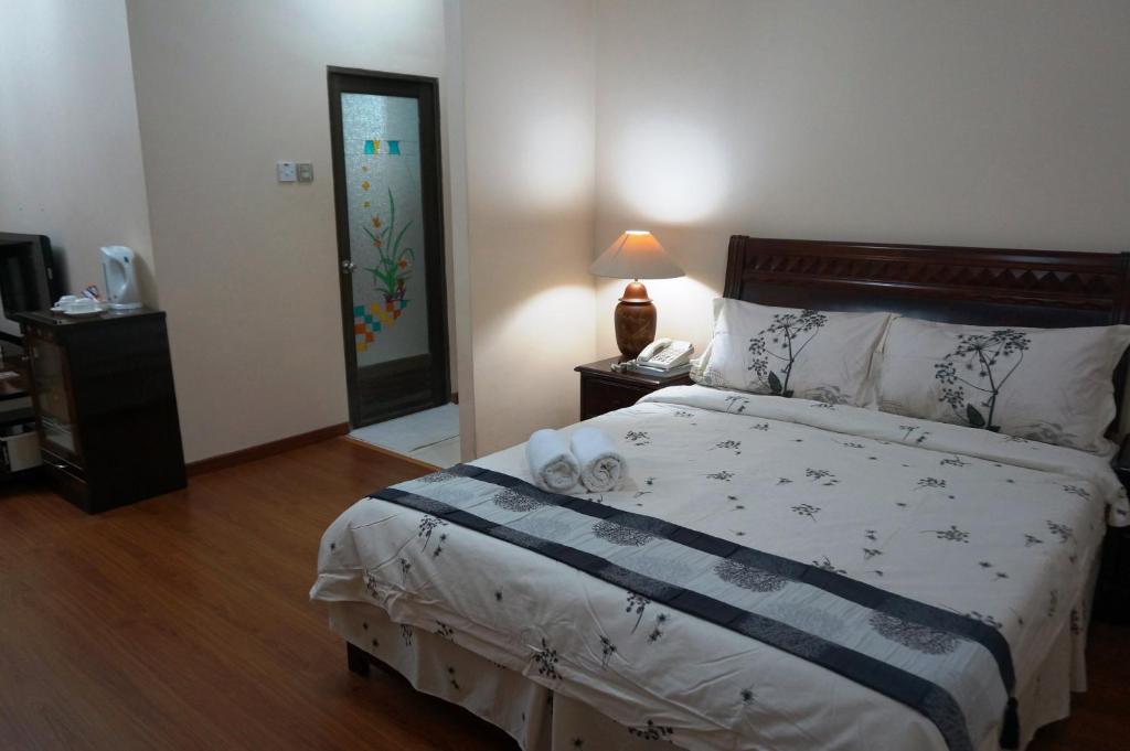 Postel nebo postele na pokoji v ubytování Jeruton Hotel