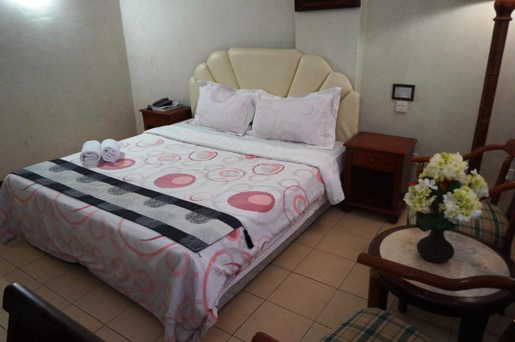Postel nebo postele na pokoji v ubytování Jeruton Hotel