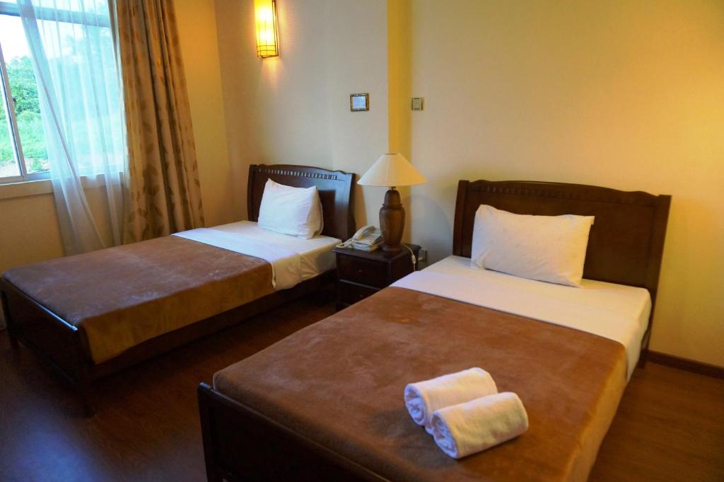 Postel nebo postele na pokoji v ubytování Jeruton Hotel