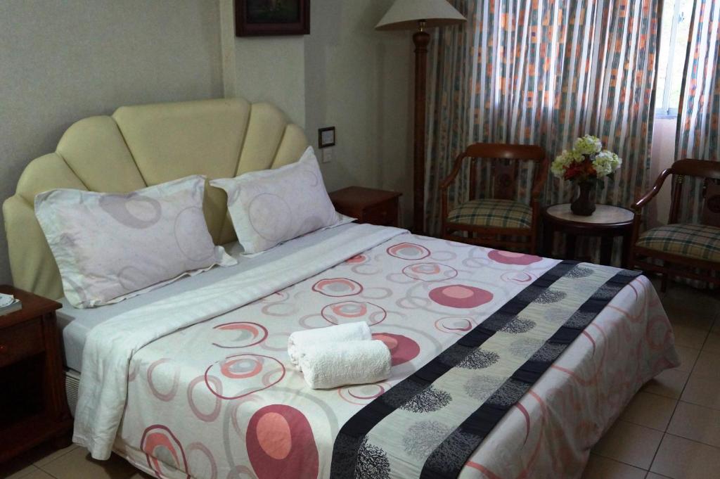 Postel nebo postele na pokoji v ubytování Jeruton Hotel